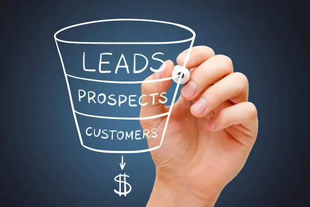 Lead generation funnel illustrated with a writing hand